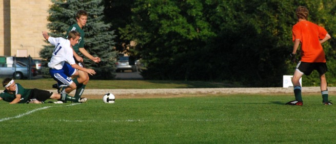 Cotter’s number eleven, Alex Lubahn, is fouled while attempting to score against La Crescent last Tuesday in Winona, MN.  